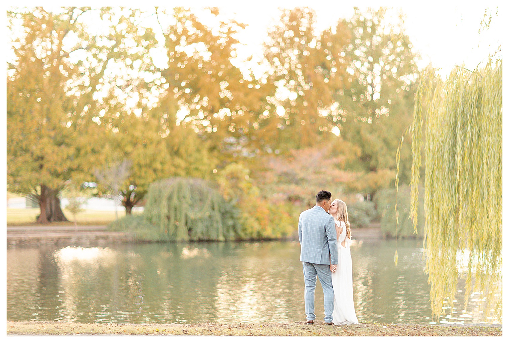 Nashville, Tennesee Engagement Photo at Centennial Park by the Parthenon photographed by Amy and Jordan. Engagement outfit inspo: white dress with blue suit